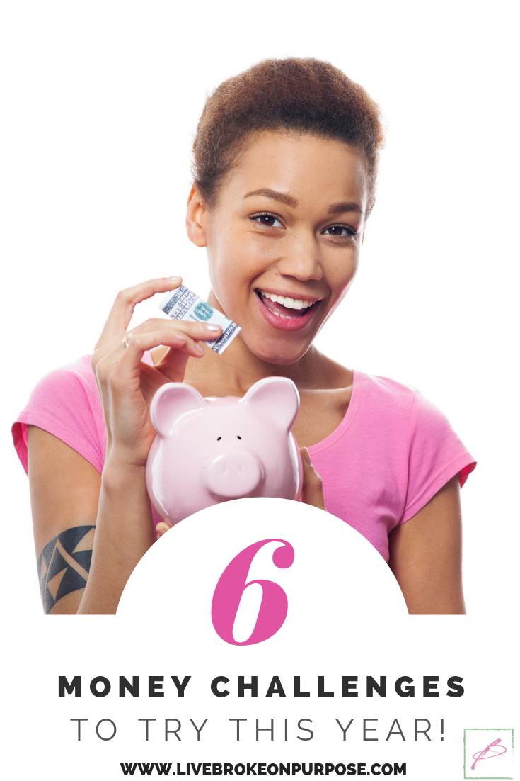 African American girl smiling and holding money over piggy bank